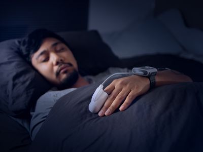 Man Wearing a Pulse Oximeter - At Home Sleep Study Test for Sleep Apnea