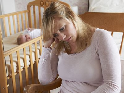 Mother In Nursery Suffering From Post Natal Depression