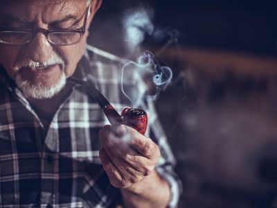 Old man smoking with pipe