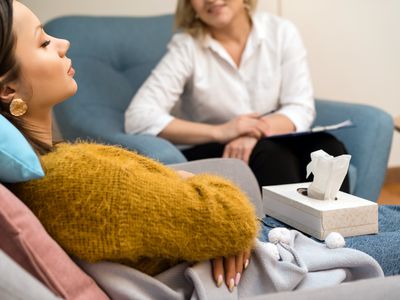 Psychologist guiding patient through hypnotherapy