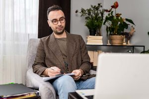 Male psychiatrist in online therapy session with his patient about eating disorders