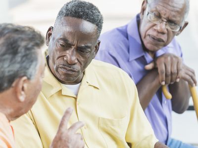 Older men in tense discussion