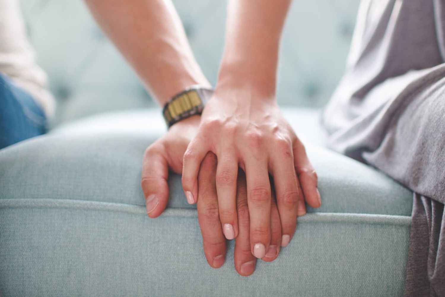 couple holding hands supporting each other 