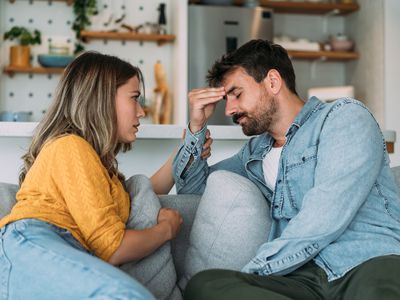 Shot of young wife expressing empathy and compassion to her sad frustrated husband.