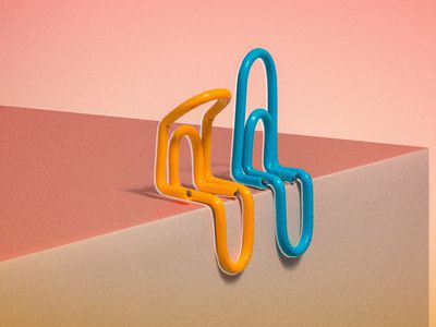 two paper clips—one bent, another upright—sitting next to one another 