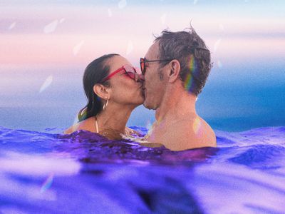 composite of two people kissing while swimming 