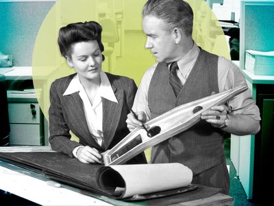 vintage image of a man and a woman looking at data in a book at work