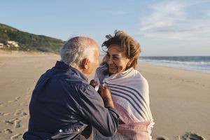 Loving senior couple enjoying vacations at beach