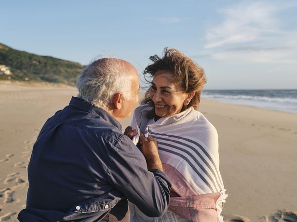 Loving senior couple enjoying vacations at beach