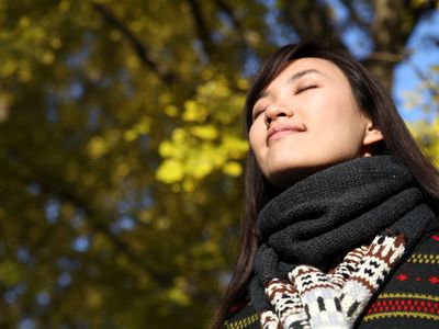 Woman enjoying the crisp cool autumn air